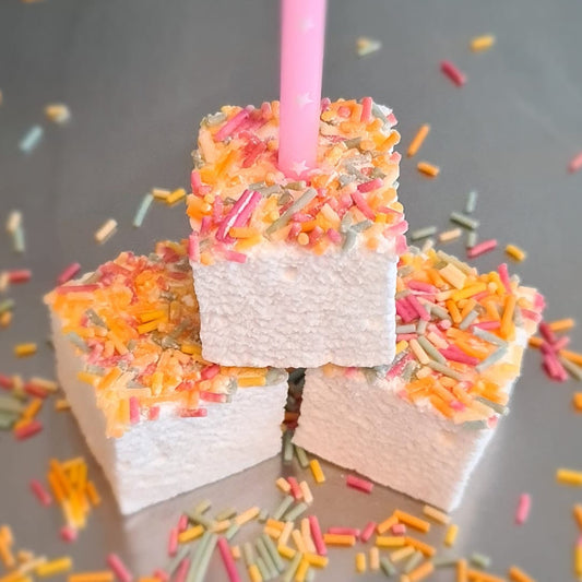 3 Birthday cake gourmet marshmallows with a candle and scattered sprinkles