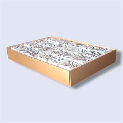 Gold gift box containing 24 Vanilla & chocolate gourmet marshmallows, side view