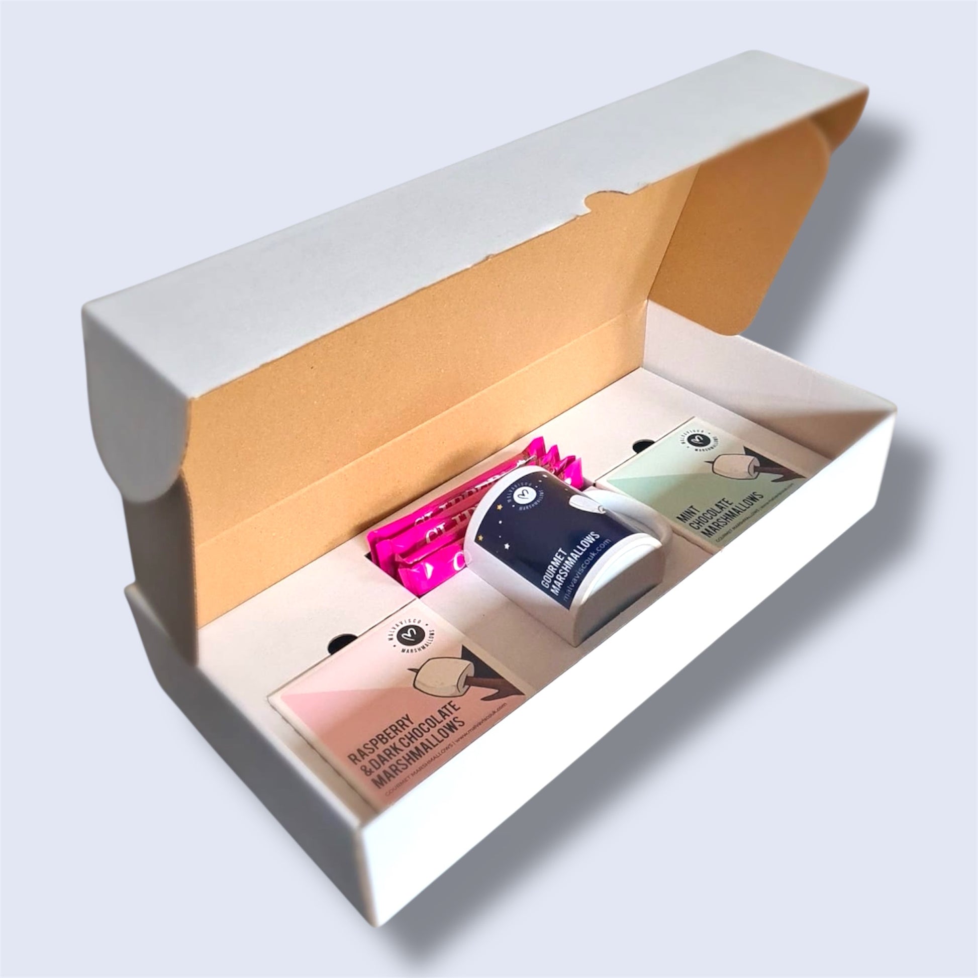 Cocoa Ritual gift box, containing 2 boxes of gourmet marshmallows, 1 mug and 4 hot chocolate sachets - side view